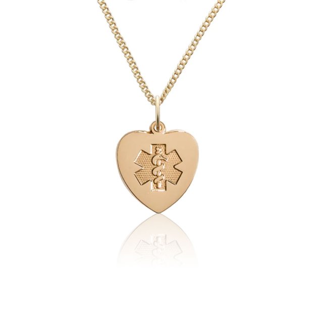 Heart-shaped gold pendant with embossed medical emblem